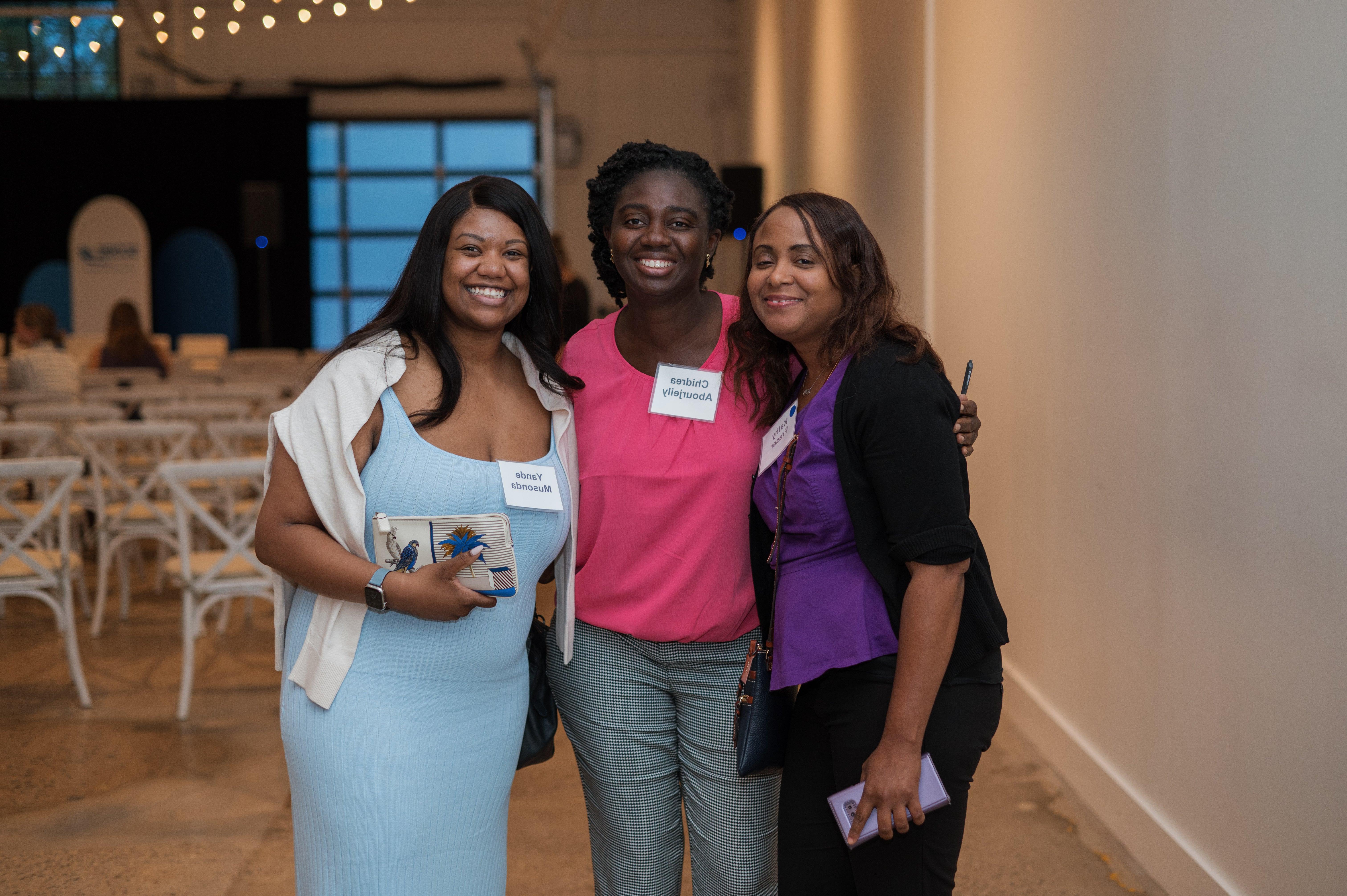 Group of Three Women posing at the Power of the Female Entrepreneur Event